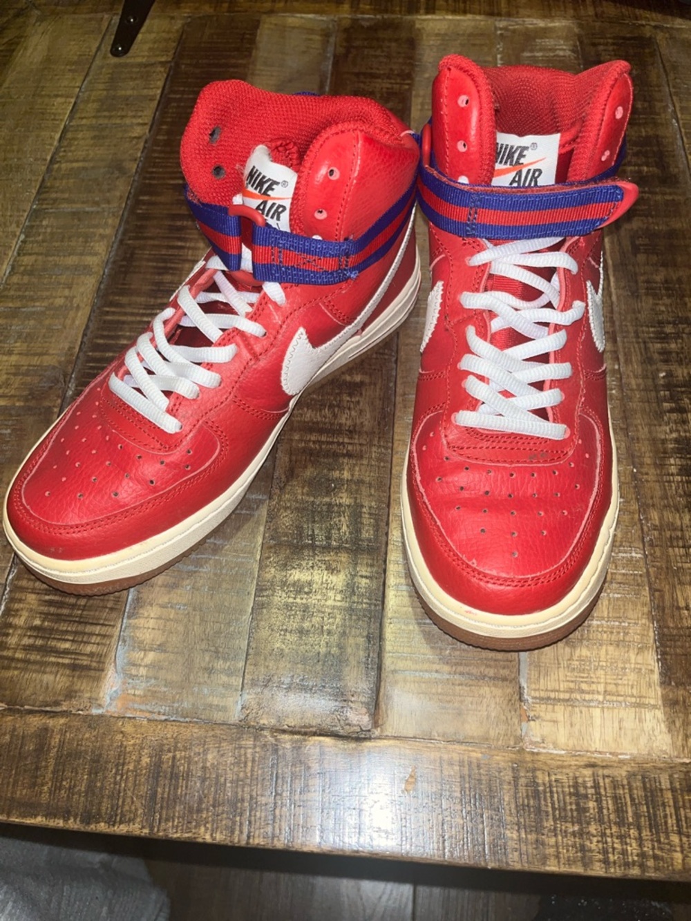Nike Red High-Top Sneakers with White Swoosh and Blue Straps